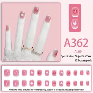Pink gradient press-on nails with red heart designs and 24-piece full set layout