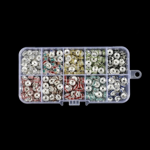 Macro shot of 10-compartment storage box with assorted colorful rhinestone spacer beads
