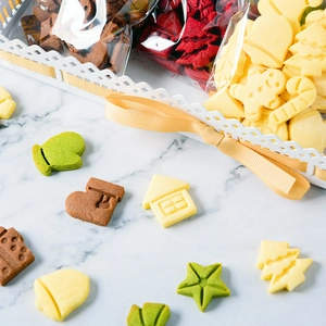 Christmas mini cookie cutters set featuring assorted holiday shapes on marble surface