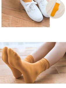 Detail of ginger yellow slouch socks showing fine knit texture and breathable velvet fabric