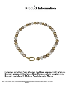 Detailed view of multi-colored 10mm pearls with golden oval clasp on white background