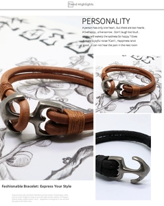 Detail view of woven leather bracelets featuring a vintage metal anchor shackle clasp