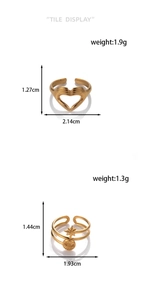 Detailed size chart showing weight and dimensions for gold heart and star steel rings