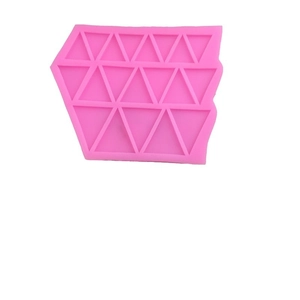 Pink silicone mold with geometric triangle patterns for chocolate and fondant making