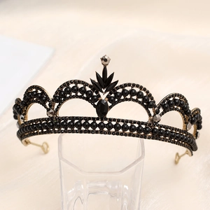 Detailed view of luxury Baroque black crystal crown on a glass display stand