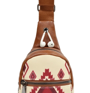 Detail of canvas sling bag with ethnic pattern, brown leather trim and headphone port