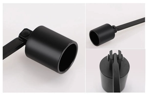 Detail of matte black stainless steel candle snuffer cap with functional hinge