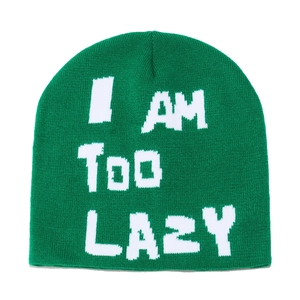 Detail view of the emerald green knit beanie with white I AM TOO LAZY text embroidery