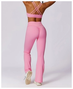 Detailed back view of pink yoga set with cross-back sports bra and scrunch leggings