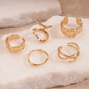 5-piece gold geometric ring set with minimalist irregular lava texture and open design