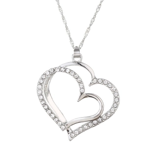 Macro shot of silver double heart pendant with sparkling rhinestones on twisted chain