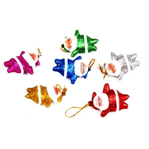 Macro detail of six glittery Santa Claus ornaments with hanging cords for Christmas tree