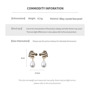 Detail showing dimensions and materials of zebra pattern pearl earrings with crystals