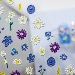 5D embossed floral nail art stickers featuring daisy and blue patterns with relief texture