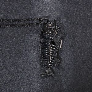 Close-up of black fishbone pendant necklace with detailed punk style metallic finish