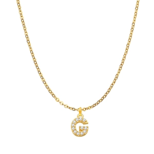 Macro detail of a gold chain necklace featuring a crystal-encrusted letter G pendant