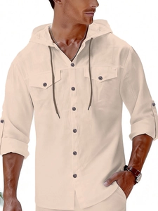 Detail of men's linen hooded shirt showing textured fabric, chest pockets and buttons