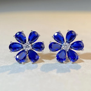 S925 sterling silver daisy studs with blue pear-cut stones and sparkling zircon centers