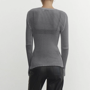 Rear view of grey slim fit long sleeve knit top with vertical ribbed texture and crew neck
