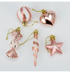 Detail of rose gold Christmas ornaments set with star and heart shapes in 4cm size