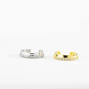 Detail of gold and silver ear cuffs with sparkling crystals for non-pierced ears