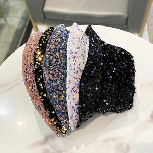Fashionable sequin bucket hats for women in multiple colors on marble background