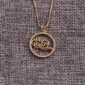 Gold plated copper necklace with a circular cloud pendant and sparkling cubic zirconia stones