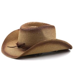 Detail view of woven gradient brown cowboy hat with leather cord and bow decoration