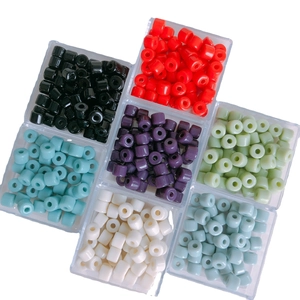 Colorful cylindrical acrylic beads for DIY jewelry making in a plastic storage box