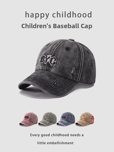 Detailed close-up of DYC letter embroidery and distressed denim fabric on kids baseball cap