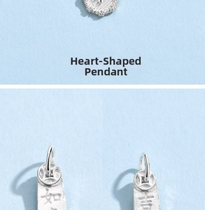 Close-up of 925 sterling silver heart charm and engraved Chinese pendants