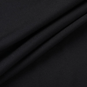 Macro dettagliata del tessuto a maglia in pizzo nero che mostra trama ed elasticità