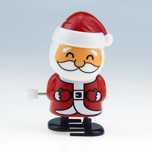 Detail of a wind-up Santa Claus toy with classic red and white Christmas design