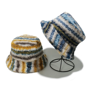 Plush faux fur bucket hat with gradient stripes in yellow and blue, winter style for women