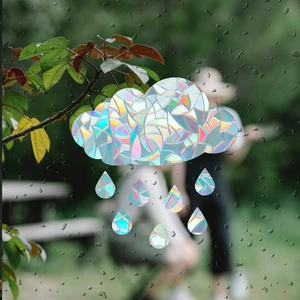Rainbow prism cloud window film creates colorful light effects on rainy glass surfaces