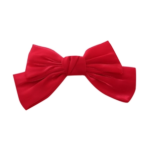 Lustrous red satin oversized bow hair clip with multi-layer silk texture on white background