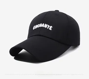 Detail view of the black cotton baseball cap featuring white ENCHANTE 3D embroidery