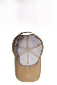 Detail view of khaki baseball cap interior showing breathable mesh lining and adjustable strap