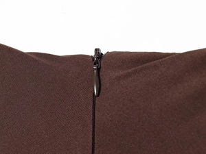Detail view of the high-quality invisible zipper on a brown casual midi dress