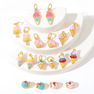 Golden ice cream and cupcake pendants collection made of enamel and gilded metal