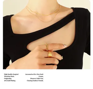 Detail of 18k gold plated surgical titanium steel double layer snake chain and rings