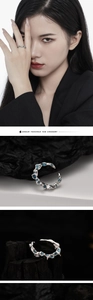 Detailed macro view of an irregular silver lava-like ring with blue coral stone accents