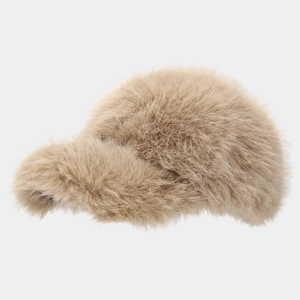 Detail of soft beige faux fox fur texture on a thick winter baseball cap for women
