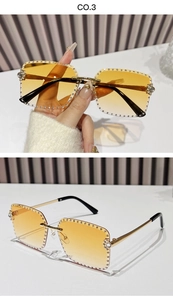 Close-up of rimless square sunglasses with hand-set rhinestones and golden metal temples