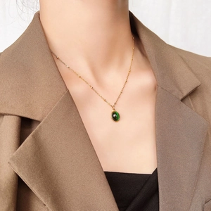 Exquisite 18k gold plated titanium steel necklace with a deep green opal pendant on neck