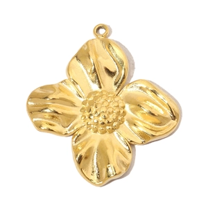 Close-up of golden four-leaf flower pendant with textured center and circular ring bail