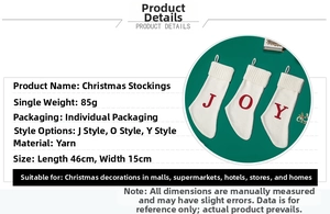 Detail view of large white knitted Christmas stockings with J/O/Y letters, 46x15cm size