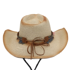 Detail showing natural straw weave and ethnic style band on a Western cowboy sun hat