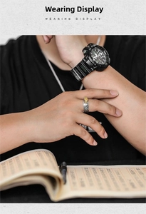Macro detail of retro men's ring with gold beast head and embossed silver texture