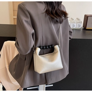 Silver litchi texture mini crossbody bag with black pearl handle and silver chain strap